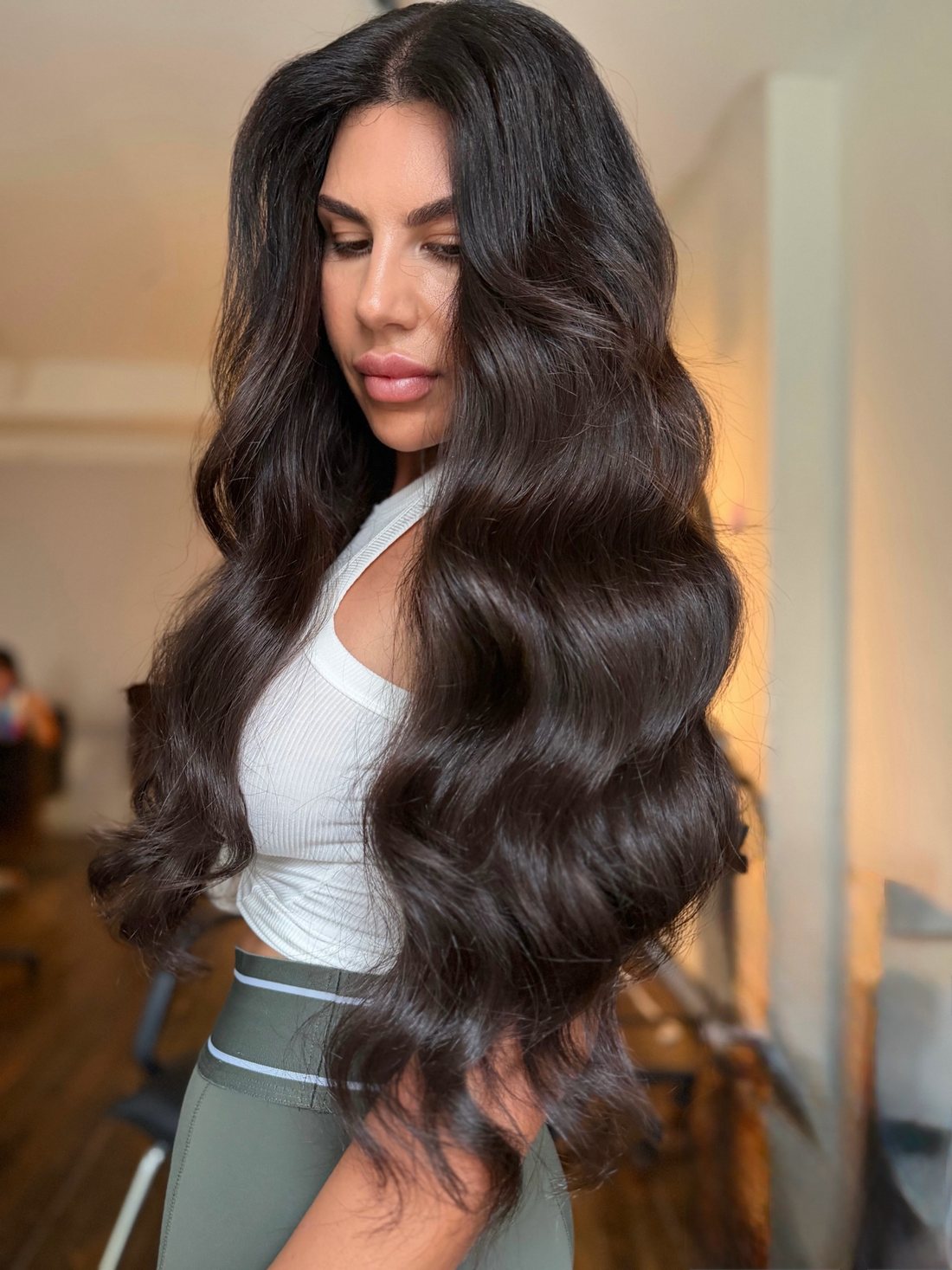 Long glossy brunette keratin bond extensions by Bond Girl Hair